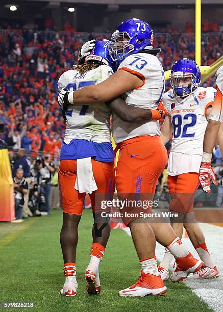 Boise State Broncos running back Jay Ajayi celebrates a first quarter touchdown with offensive lineman Travis Averill during the Vizio Fiesta Bowl...