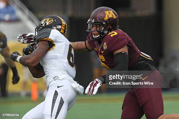 Minnesota Golden Gophers linebacker Damien Wilson chases down Missouri Tigers running back Marcus Murphy during the Buffalo Wild Wings Citrus Bowl...