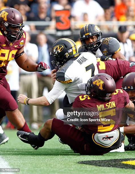 Minnesota Golden Gophers linebacker Damien Wilson sacks Missouri Tigers quarterback Maty Mauk in the first half of play at the Florida Citrus Bowl...