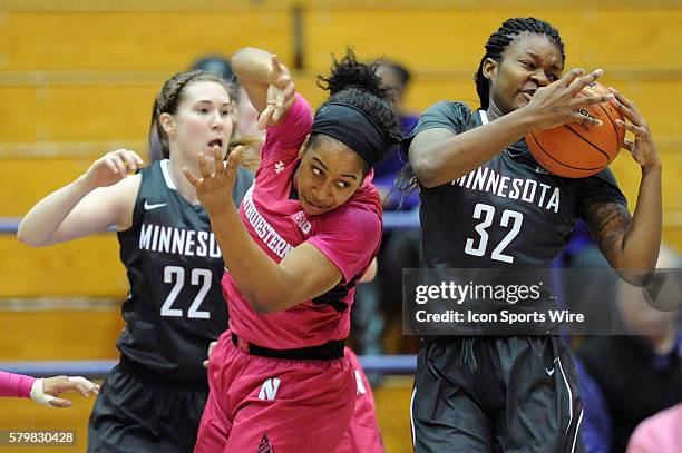 Minnesota Golden Gophers center Karley Barnes grabs the rebound next t Northwestern Wildcats forward Pallas Kunaiyi-Akpanah and Minnesota Golden...