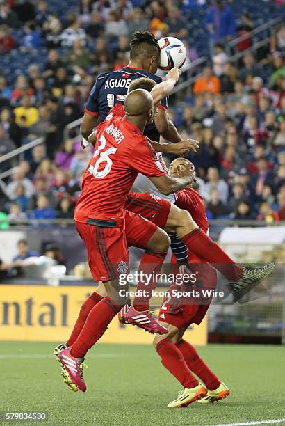 New England Revolution forward Juan Agudelo beats Toronto FC midfielder Collen Warner in the air. The New England Revolution and Toronto FC played to...