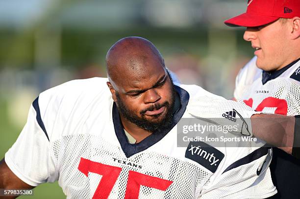 Houston Texans Defensive End J.J. Watt roughs up Houston Texans Defensive Tackle Vince Wilfork before practice at the Texans Training Camp at Houston...