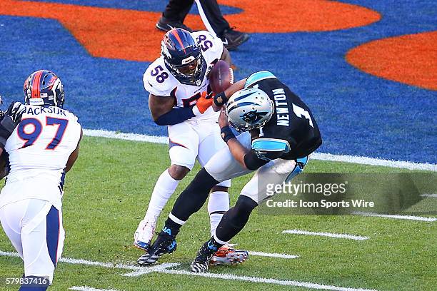 Denver Broncos outside linebacker Von Miller takes the ball away from Carolina Panthers quarterback Cam Newton causing a fumble during the first...