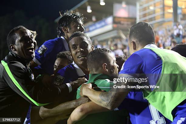 New York's Andres Flores is mobbed by teammates after he scored the tying goal in the final minute. The Carolina RailHawks hosted the New York Cosmos...