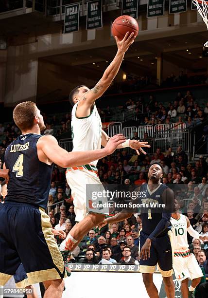 University of Miami guard Angel Rodriguez shoots against the University of Pittsburgh in Miami's 65-63 victory at BankUnited Center, Coral Gables,...