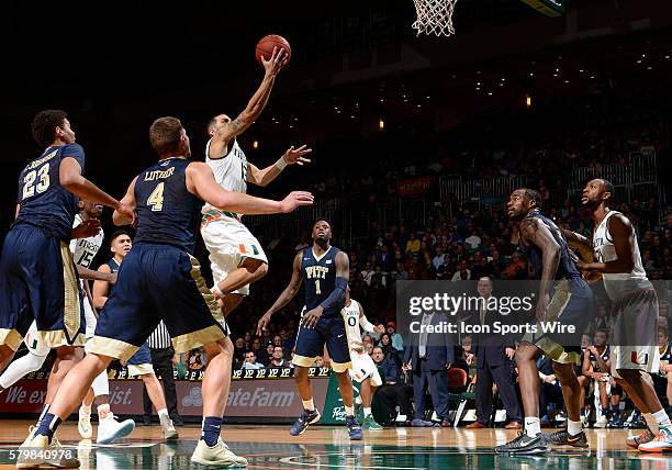 University of Miami guard Angel Rodriguez shoots against the University of Pittsburgh in Miami's 65-63 victory at BankUnited Center, Coral Gables,...