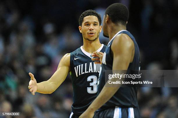 Villanova Wildcats guard Josh Hart smiles while talking with Villanova Wildcats forward Kris Jenkins during a game between the Villanova Wildcats and...