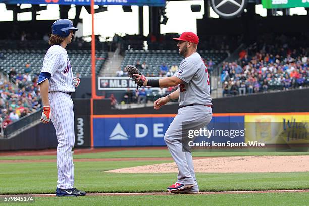 New York Mets Starting pitcher Jacob deGrom [10741] waits on the first base line to be tagged out by St. Louis Cardinals First base Matt Adams [7766]...