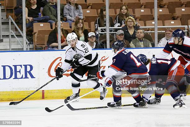 Manchester Monarchs right wing Brian O'Neill looks to center the puck covered by Hartford Wolf Pack Left Wing Chris Bourque and Hartford Wolf Pack...