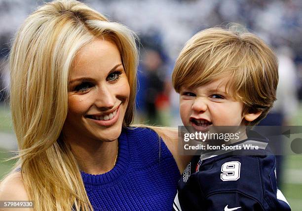 Candice Romo and son River on the sidelines prior to a NFC Wild-Card game between the Dallas Cowboys and Detroit Lions at AT&T Stadium in Arlington,...