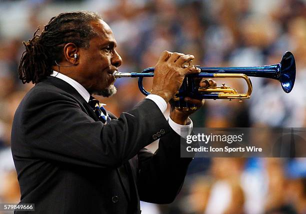 Trumpet player Freddie Jones plays the National Anthem prior to a NFC Wild-Card game between the Dallas Cowboys and Detroit Lions at AT&T Stadium in...