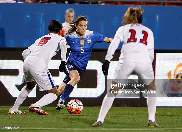 February 2016 - United States defender Kelley O'Hara dribbles as Puerto Rico forward Ashley Johnson defends during the Olympic Qualifying first round...