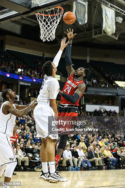 Louisville Cardinals forward Montrezl Harrell goes up for the layup against Wake Forest Demon Deacons forward Devin Thomas in the first half during...