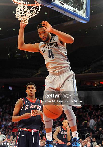 Villinova guard Darrun Hilliard looks down as he slams home a big dunk in the second half of the game against St.Johns .Villinova went on to win the...