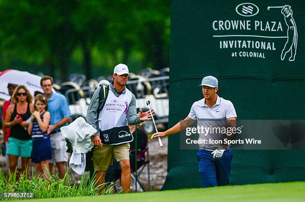 Kevin Chappell tosses his putter to his caddie in disgust following a chip onto the 9th green during final round action of the Crowne Plaza...