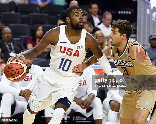 Kyrie Irving of the United States is guarded by Nicolas Laprovittola of Argentina during a USA Basketball showcase exhibition game at T-Mobile Arena...