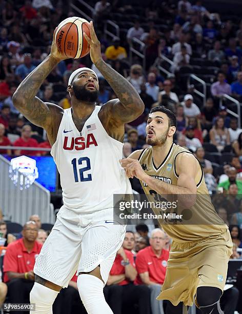 DeMarcus Cousins of the United States shoots against Roberto Santiago Acuna of Argentina during a USA Basketball showcase exhibition game at T-Mobile...