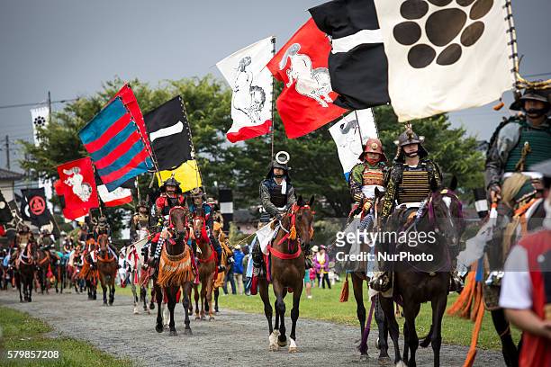 Samurai horsemen is seen parade during the &quot;Hon Matsuri&quot;, Soma Nomaoi festival at Hibarigahara field on Sunday, July 24, 2016 in...