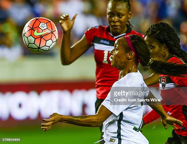 United States Forward Crystal Dunn focuses on the ball as she heads for the goal during the Women's Olympic qualifying soccer match between USA and...