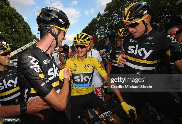 Chris Froome of Great Britain and Team Sky is congratulated by Wouter Poels of the Netherlands and Team Sky and Ian Stannard of Great Britain and...