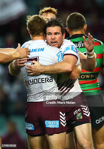 Jamie Lyon of the Eagles celebrates scoring a try with team mates during the round 20 NRL match between the South Sydney Rabbitohs and the Manly Sea...