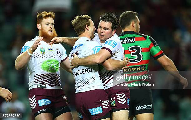 Jamie Lyon of the Eagles celebrates scoring a try with team mates during the round 20 NRL match between the South Sydney Rabbitohs and the Manly Sea...