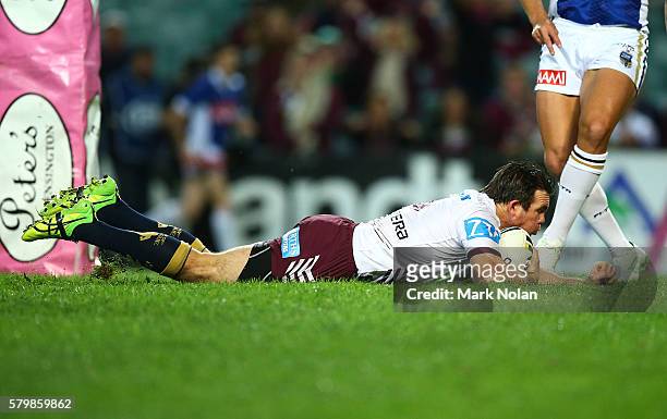 Jamie Lyon of the Eagles scores a try during the round 20 NRL match between the South Sydney Rabbitohs and the Manly Sea Eagles at Allianz Stadium on...