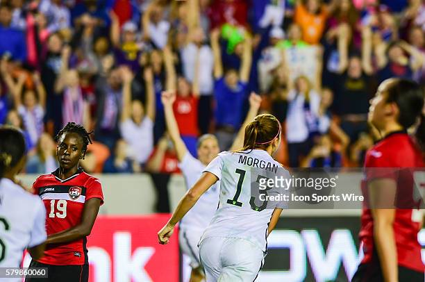 United States Forward Alex Morgan celebrates a second half goal, one of her three on the night during the Women's Olympic qualifying soccer match...