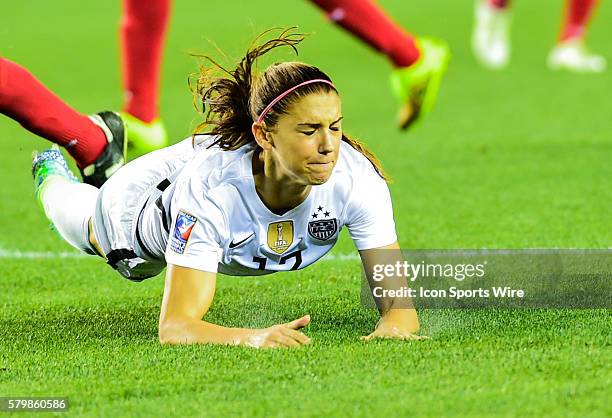 United States Forward Alex Morgan takes a hard fall after collision with a Trinidad defender during the Women's Olympic qualifying soccer match...
