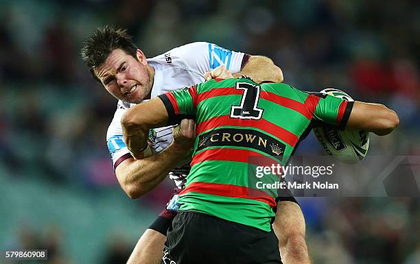 Jamie Lyon of the Eagles tackles Cody Walker of the Rabbitohs during the round 20 NRL match between the South Sydney Rabbitohs and the Manly Sea...