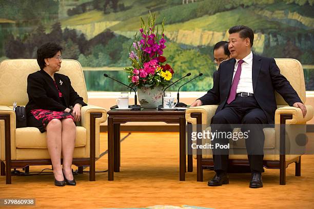 World Health Organization Director-General Margaret Chan, and Chinese President Xi Jinping, right, speak during a meeting at the Great Hall of the...