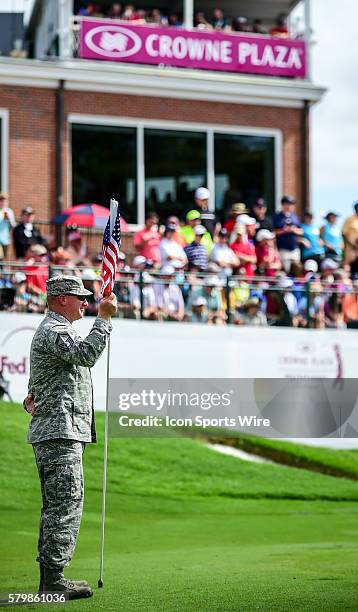 An Air Force SMSgt mans the pin on during final round action of the Crowne Plaza Invitational at Colonial in Ft. Worth, Texas.