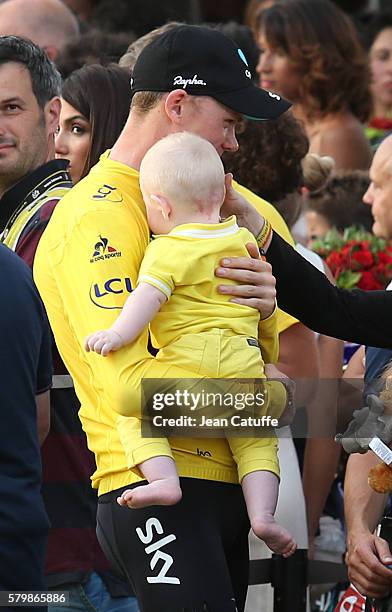 Chris Froome of Great Britain and Team Sky hugs his son Kellan Froome following stage 21, last stage of the Tour de France 2016 between Chantilly and...