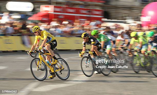 Chris Froome of Great Britain and Team Sky, wearing the leader's yellow jersey rides among the pack during stage 21, last stage of the Tour de France...