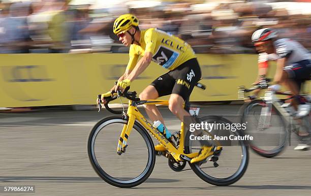 Chris Froome of Great Britain and Team Sky, wearing the leader's yellow jersey rides among the pack during stage 21, last stage of the Tour de France...