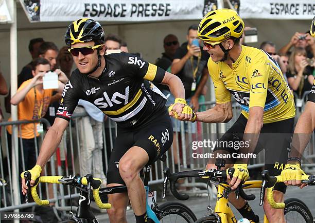 Chris Froome of Great Britain and Team Sky, wearing the leader's yellow jersey is congratulated by teammate and countryman Geraint Thomas while...