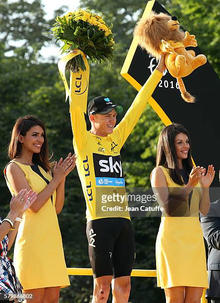 Chris Froome of Great Britain and Team Sky wearing the leader's yellow jersey celebrates winning the Tour de France 2016 following stage 21, last...