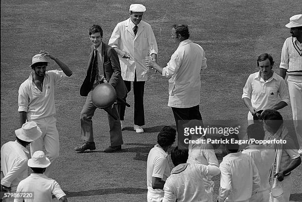 Angus Loughran brings a stool onto the pitch for England batsman Chris Tavare during a drinks break on the last day of the 3rd Test match between...