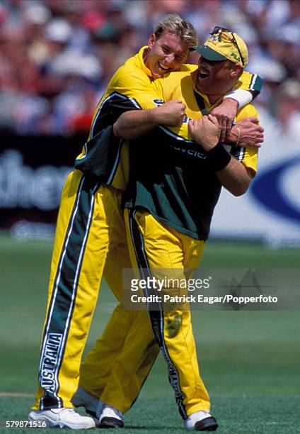 Brett Lee of Australia congratulates Shane Warne after he had taken the catch of Lee's bowling to dismiss Nick Knight of England during the NatWest...