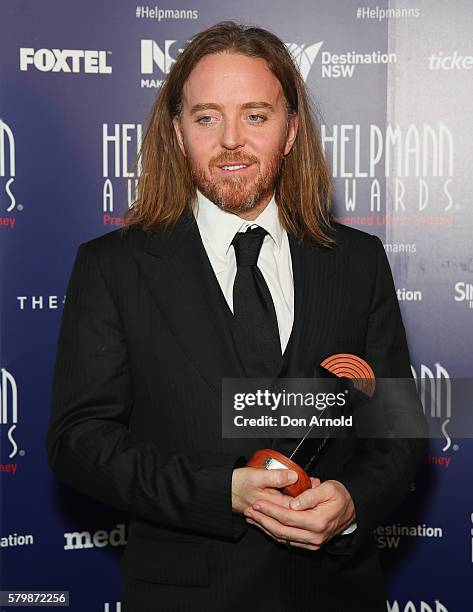 Tim Minchin poses with the award for Best Musical Score in a Musical in the awards room at the 16th Annual Helpmann Awards at Lyric Theatre, Star...