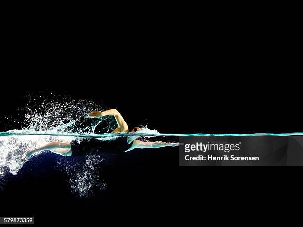 female swimmer in front crawl - swimmer athlete stock pictures, royalty-free photos & images
