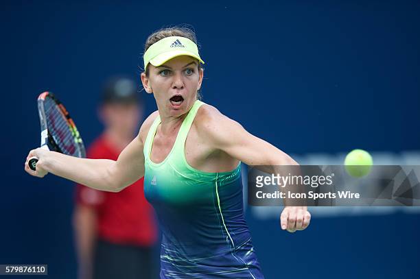 Simona Halep of Romania eyes the ball during her Round 3 match against Angelique Kerber of Germany on day 4 of the Rogers Cup tournament at the Aviva...