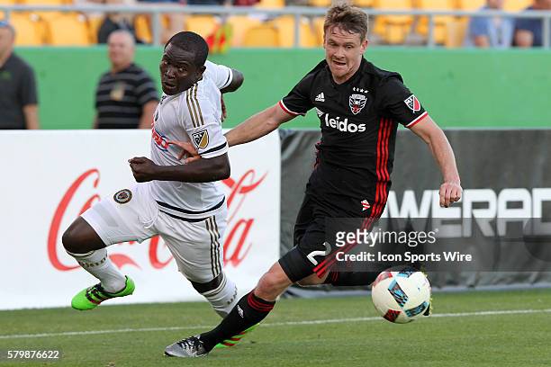 Philadelphia's Maurice Edu fights for the ball as DC United's Taylor Kemp defends during the pre-season MLS match between the D. C. United and the...