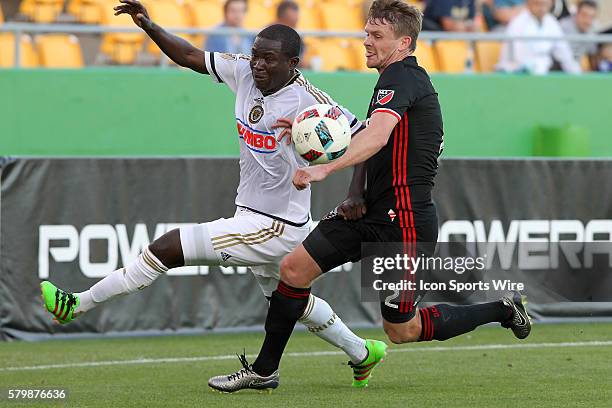 Philadelphia's Maurice Edu fights for the ball as DC United's Taylor Kemp defends during the pre-season MLS match between the D. C. United and the...