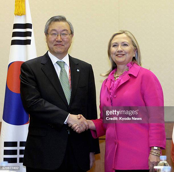 South Korea - U.S. Secretary of State Hillary Clinton and South Korean Foreign Affairs and Trade Minister Kim Sung Hwan shake hands prior to holding...