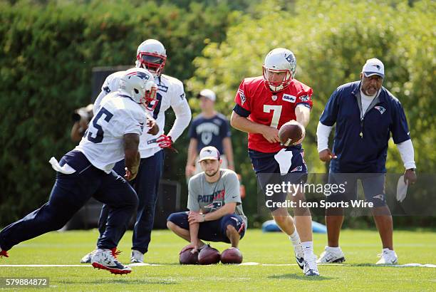 New England Patriots quarterback Ryan Lindley hands off to New England Patriots running back Jonas Gray during New England Patriots training camp.