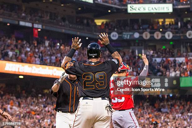 San Francisco Giants catcher Hector Sanchez celebrates scoring off a 3-run double by San Francisco Giants third baseman Matt Duffy , in the 3rd...