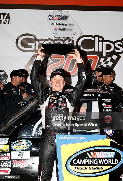 John Hunter Nemechek celebrates winning the Great Clips 200 NASCAR Camping World Truck Series race at the Atlanta Motor Speedway in Hampton, GA.