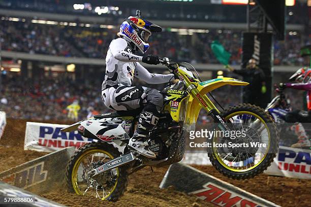Yoshimura Suzuki 450cc rider James Stewart over a jump during the night time portion in round 8 of the AMA Monster Energy Supercross Championship,...