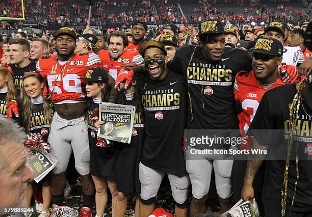 Ohio State players including Ohio State Buckeyes defensive end Tyquan Lewis and cheerleaders celebrate after the Ohio State Buckeyes game versus the...